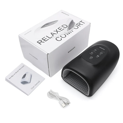 Black Wireless Hand Massager in its box with charging cable and instruction manual included.